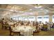 Large dining room with ample seating for residents at 6503 Stone River Rd # 109, Bradenton, FL 34203