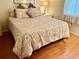 Bedroom with queen-size bed and wood floors at 6503 Stone River Rd # 109, Bradenton, FL 34203