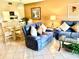 Comfortable living room with a sofa, recliner, and glass-top coffee table at 6503 Stone River Rd # 109, Bradenton, FL 34203