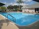 Refreshing community pool with ample lounge chairs at 6503 Stone River Rd # 109, Bradenton, FL 34203