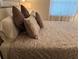 Cozy bedroom with a double bed and patterned bedding at 6503 Stone River Rd # 109, Bradenton, FL 34203