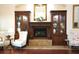 Elegant fireplace with built-in shelving and comfortable seating at 6503 Stone River Rd # 109, Bradenton, FL 34203