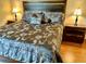 King-size bedroom with nightstands and wood floors at 6503 Stone River Rd # 109, Bradenton, FL 34203