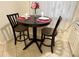 Dark wood kitchen table with two bar stools at 6503 Stone River Rd # 109, Bradenton, FL 34203