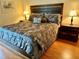 King-size bedroom with nightstands and wood floors at 6503 Stone River Rd # 109, Bradenton, FL 34203
