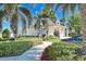 Landscaped clubhouse with a welcoming entrance at 8389 Wingate Dr # 2322, Sarasota, FL 34238