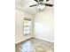 Bedroom with tile floor, window, and ceiling fan at 8389 Wingate Dr # 2322, Sarasota, FL 34238