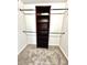 Spacious walk-in closet with built-in shelving and hanging rods at 8389 Wingate Dr # 2322, Sarasota, FL 34238