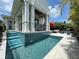 Private pool with tiled steps and covered patio at 590 Hibiscus Way, Longboat Key, FL 34228