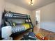 bedroom with a built-in bunk bed and colorful rug at 590 Hibiscus Way, Longboat Key, FL 34228