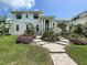 Two-story home with modern design and landscaping at 590 Hibiscus Way, Longboat Key, FL 34228