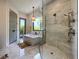 Modern bathroom with a large walk-in shower and soaking tub at 590 Hibiscus Way, Longboat Key, FL 34228