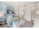 Bright bedroom with ensuite bathroom access and neutral decor at 5565 Long Shore Loop, Sarasota, FL 34238