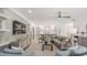Spacious living room with a comfortable sectional sofa and large TV at 5565 Long Shore Loop, Sarasota, FL 34238