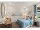 Light and airy bedroom with coastal decor at 5565 Long Shore Loop, Sarasota, FL 34238