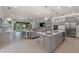 Modern kitchen with island and stainless steel appliances at 5565 Long Shore Loop, Sarasota, FL 34238