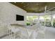 Outdoor kitchen with bar seating, granite countertops, and modern appliances at 5565 Long Shore Loop, Sarasota, FL 34238