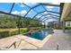 Enjoy this relaxing screened in pool and spa area at 5565 Long Shore Loop, Sarasota, FL 34238