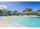 Resort-style pool with surrounding lounge chairs and landscaping at 5565 Long Shore Loop, Sarasota, FL 34238
