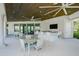 Community patio with seating areas and ceiling fans at 5565 Long Shore Loop, Sarasota, FL 34238