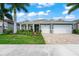 Two-story home with a two-car garage at 5565 Long Shore Loop, Sarasota, FL 34238