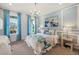 Cozy bedroom with light blue color scheme and a comfortable bed at 5565 Long Shore Loop, Sarasota, FL 34238
