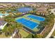 Two well-maintained tennis courts at 5565 Long Shore Loop, Sarasota, FL 34238