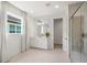Bright bathroom with a walk-in shower and modern vanity at 5565 Long Shore Loop, Sarasota, FL 34238