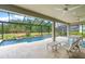 Relaxing screened pool and spa with ample seating at 5565 Long Shore Loop, Sarasota, FL 34238