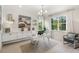 Bright home office with built-in shelving and large windows at 5565 Long Shore Loop, Sarasota, FL 34238