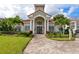 Building entrance with columns and landscaping at 210 3Rd W St # 8407, Bradenton, FL 34205