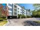 Three-story building with covered parking and landscaping at 210 3Rd W St # 8407, Bradenton, FL 34205