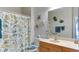 Clean bathroom with a shower/tub combo and coastal decor at 210 3Rd W St # 8407, Bradenton, FL 34205