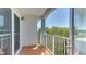 Private balcony overlooking lush trees and partial water view at 210 3Rd W St # 8407, Bradenton, FL 34205