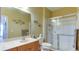 Bathroom with a walk-in shower and a single vanity at 210 3Rd W St # 8407, Bradenton, FL 34205