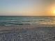 Scenic beach at sunset with footprints in the sand at 519 Rountree Dr, Longboat Key, FL 34228