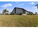 Exterior view showcasing well-manicured lawn and canal views at 3920 Bal Harbor Blvd # D8, Punta Gorda, FL 33950