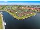 Aerial view of waterfront community with boat slips and lush landscaping at 3920 Bal Harbor Blvd # D8, Punta Gorda, FL 33950