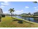 Scenic waterfront property with lush lawn and dock access at 3920 Bal Harbor Blvd # D8, Punta Gorda, FL 33950