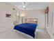 Bright bedroom with a ceiling fan and en-suite bathroom access at 3920 Bal Harbor Blvd # D8, Punta Gorda, FL 33950