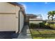 House exterior showcasing the attached garage and landscaping at 3920 Bal Harbor Blvd # D8, Punta Gorda, FL 33950