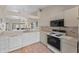 Kitchen with white appliances and canal view at 3920 Bal Harbor Blvd # D8, Punta Gorda, FL 33950