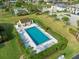 Community pool with ample lounge chairs and fenced area at 3920 Bal Harbor Blvd # D8, Punta Gorda, FL 33950