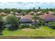 Aerial view of homes with pools and lush landscaping at 13853 Siena Loop, Lakewood Ranch, FL 34202