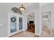 Bright and spacious entryway with double doors and views into an office and bathroom at 13853 Siena Loop, Lakewood Ranch, FL 34202