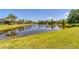 Serene lake view with reflection of homes and trees at 13853 Siena Loop, Lakewood Ranch, FL 34202