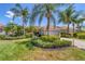 Single-story house with a tile roof, landscaping, and a paved driveway at 13853 Siena Loop, Lakewood Ranch, FL 34202