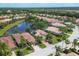 Aerial view of community, highlighting the neighborhood layout and lake at 13853 Siena Loop, Lakewood Ranch, FL 34202