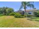 Landscaped backyard with lush greenery and pool enclosure at 13853 Siena Loop, Lakewood Ranch, FL 34202