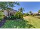 Spacious backyard with lush landscaping, screened enclosure, and pond view at 13853 Siena Loop, Lakewood Ranch, FL 34202